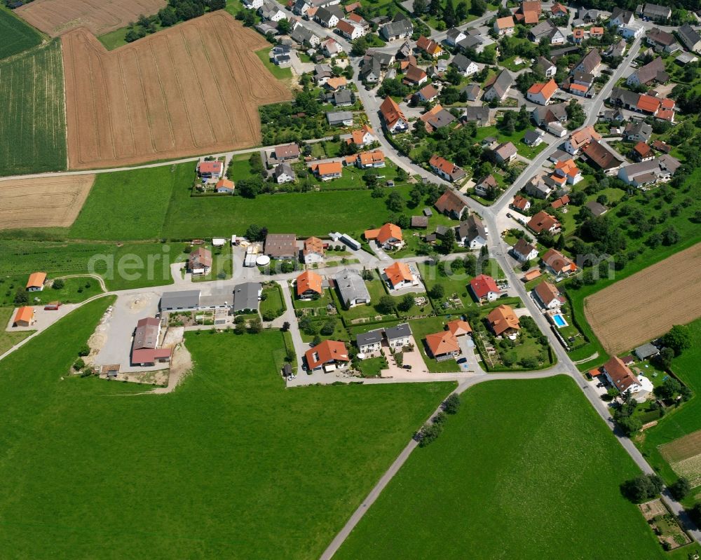 Wald from the bird's eye view: Agricultural land and field boundaries surround the settlement area of the village in Wald in the state Baden-Wuerttemberg, Germany