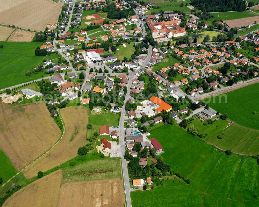 Wald from above - Agricultural land and field boundaries surround the settlement area of the village in Wald in the state Baden-Wuerttemberg, Germany