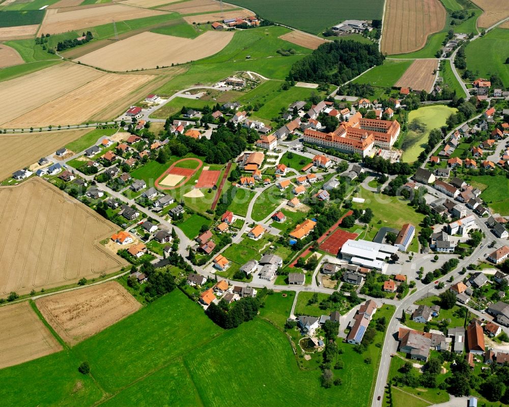 Wald from the bird's eye view: Agricultural land and field boundaries surround the settlement area of the village in Wald in the state Baden-Wuerttemberg, Germany