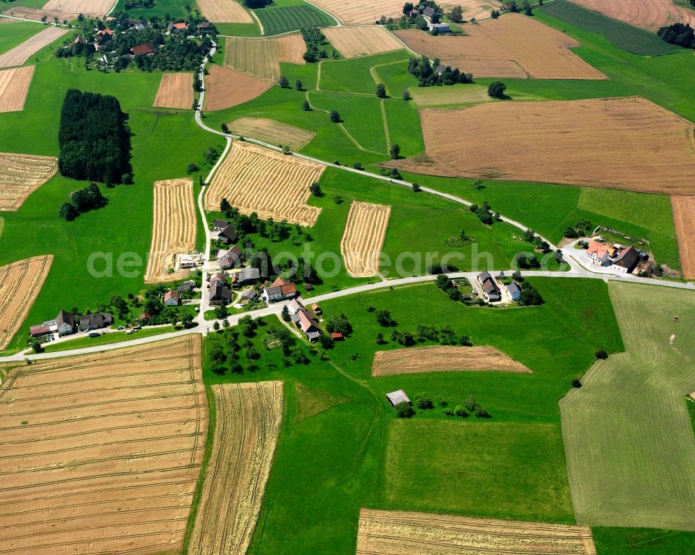 Wald from above - Agricultural land and field boundaries surround the settlement area of the village in Wald in the state Baden-Wuerttemberg, Germany