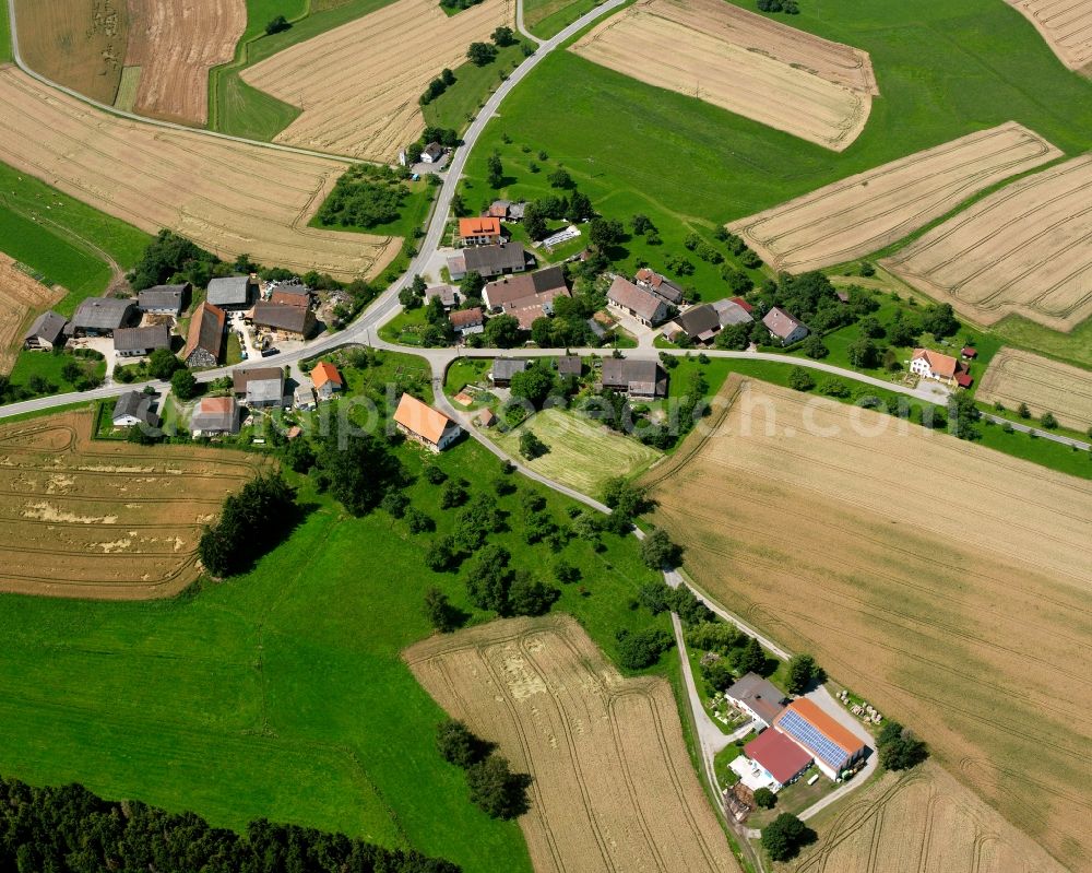 Wald from the bird's eye view: Agricultural land and field boundaries surround the settlement area of the village in Wald in the state Baden-Wuerttemberg, Germany