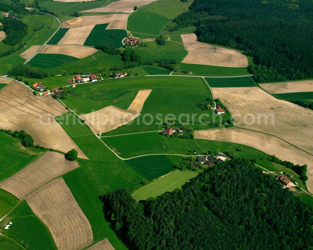 Wald from above - Agricultural land and field boundaries surround the settlement area of the village in Wald in the state Bavaria, Germany