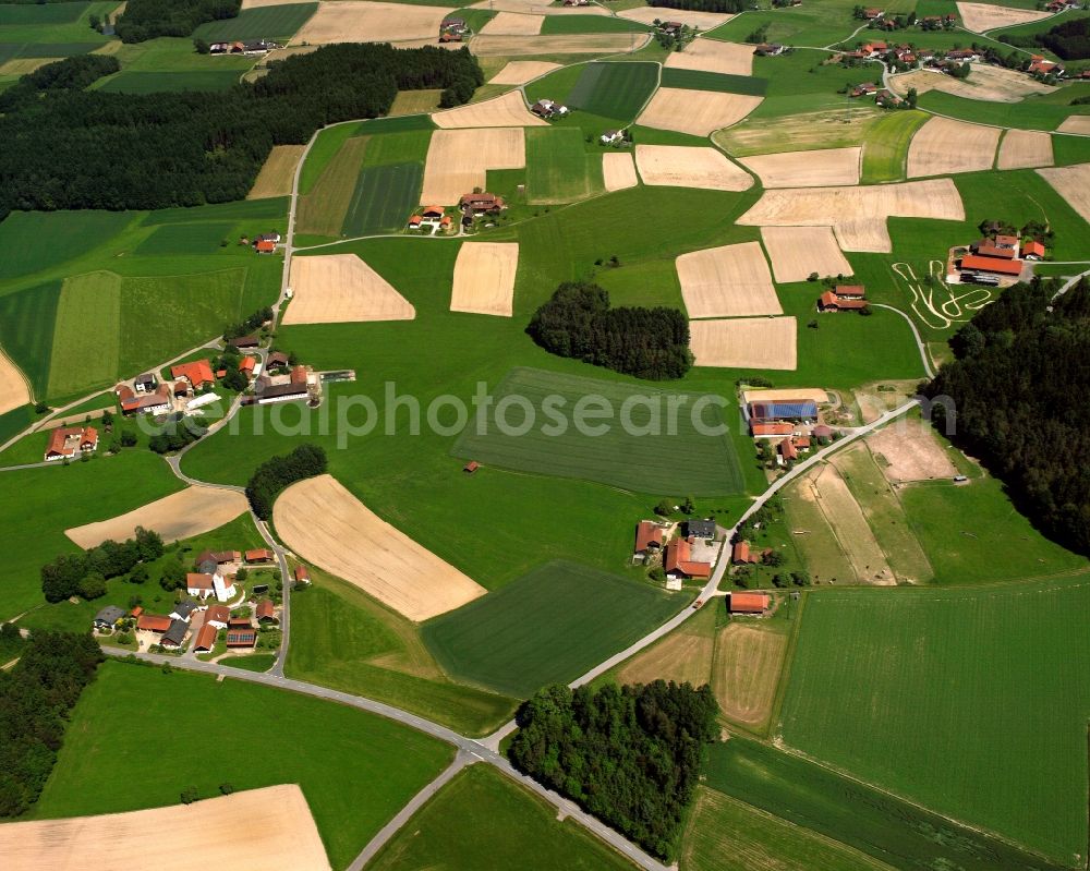 Wald from above - Agricultural land and field boundaries surround the settlement area of the village in Wald in the state Bavaria, Germany