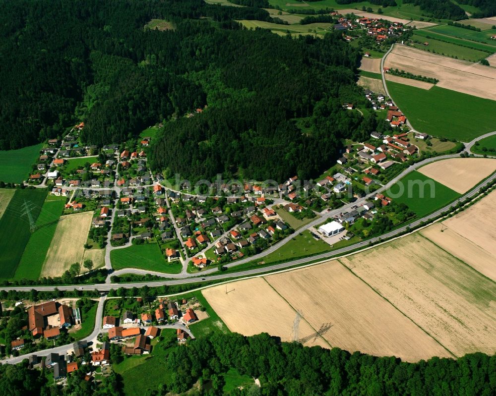 Waltersdorf from the bird's eye view: Agricultural land and field boundaries surround the settlement area of the village in Waltersdorf in the state Bavaria, Germany