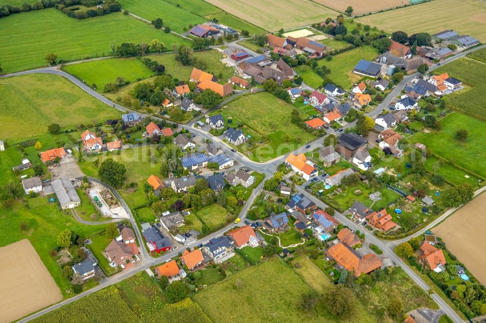 Aerial image Wambeln - Agricultural land and field boundaries surround the settlement area of the village in Wambeln in the state North Rhine-Westphalia, Germany