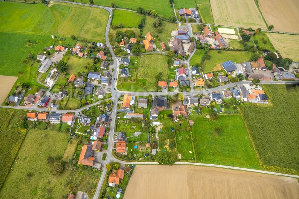 Aerial photograph Wambeln - Agricultural land and field boundaries surround the settlement area of the village in Wambeln in the state North Rhine-Westphalia, Germany