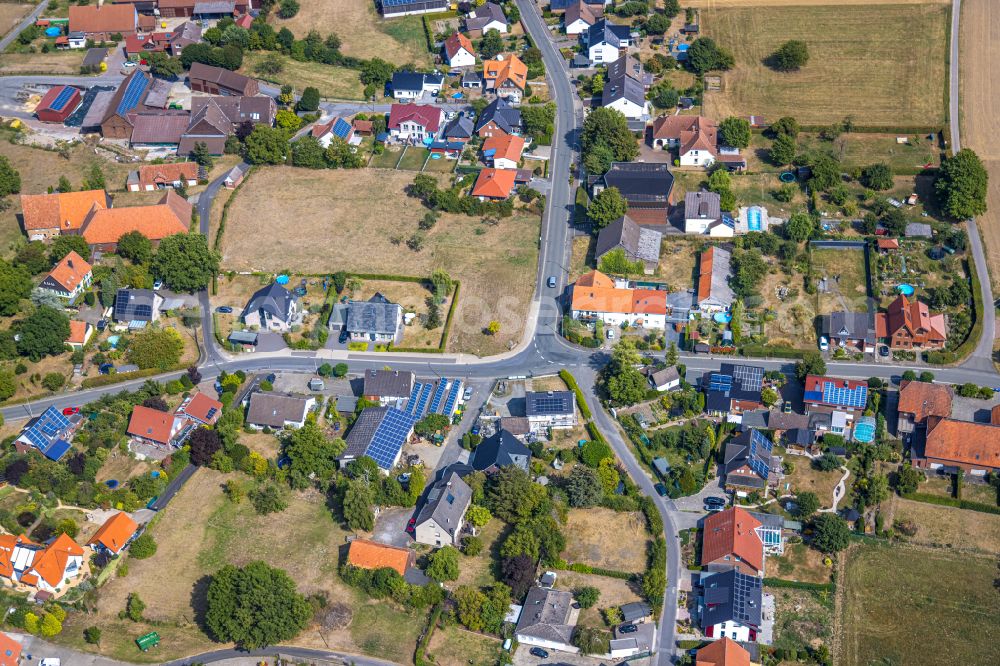 Wambeln from above - Agricultural land and field boundaries surround the settlement area of the village in Wambeln in the state North Rhine-Westphalia, Germany