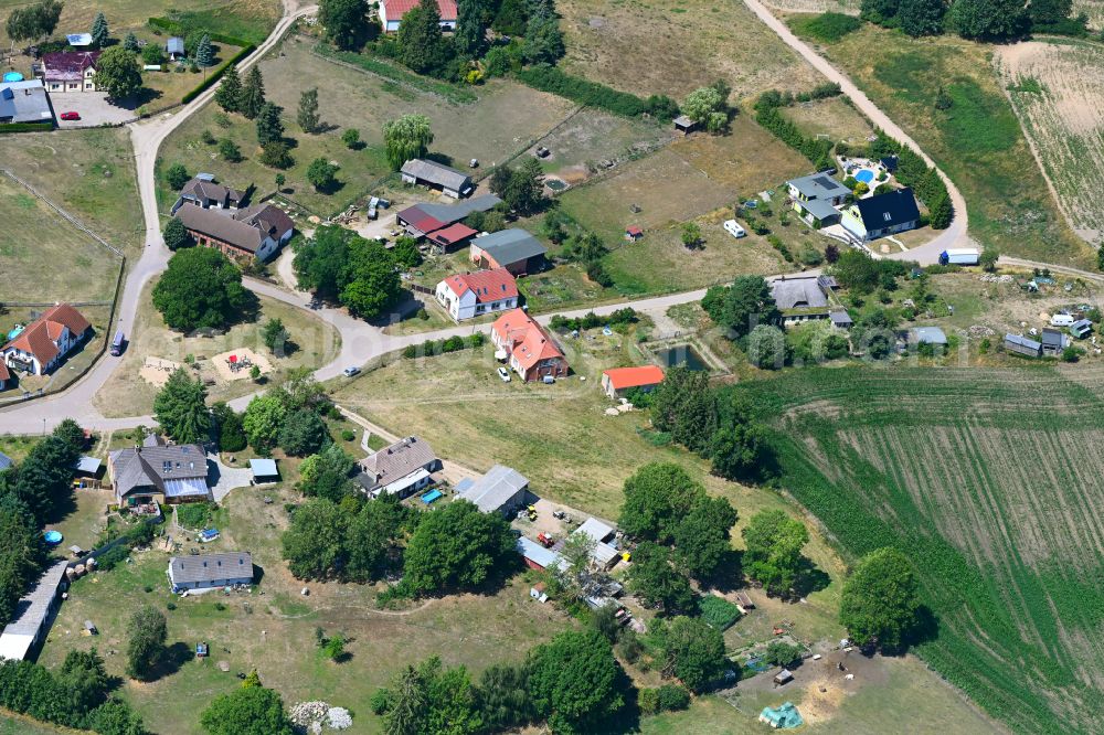 Warin from the bird's eye view: Agricultural land and field boundaries surround the settlement area of the village in Warin in the state Mecklenburg - Western Pomerania, Germany