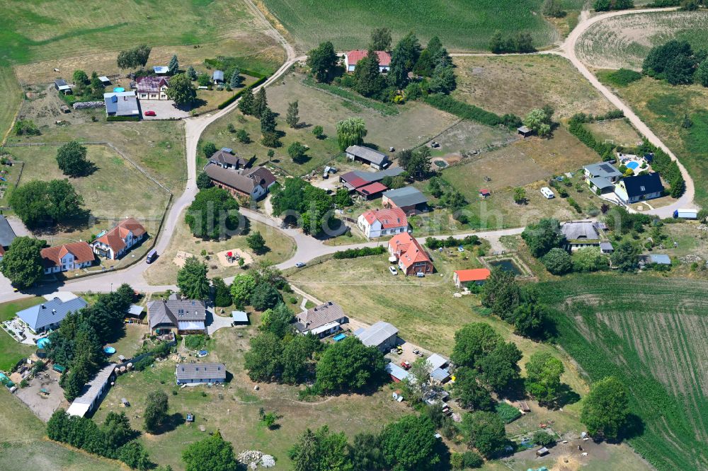 Aerial image Warin - Agricultural land and field boundaries surround the settlement area of the village in Warin in the state Mecklenburg - Western Pomerania, Germany