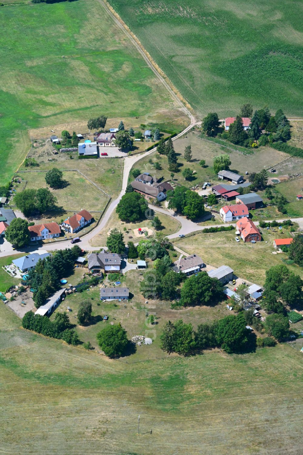 Aerial photograph Warin - Agricultural land and field boundaries surround the settlement area of the village in Warin in the state Mecklenburg - Western Pomerania, Germany