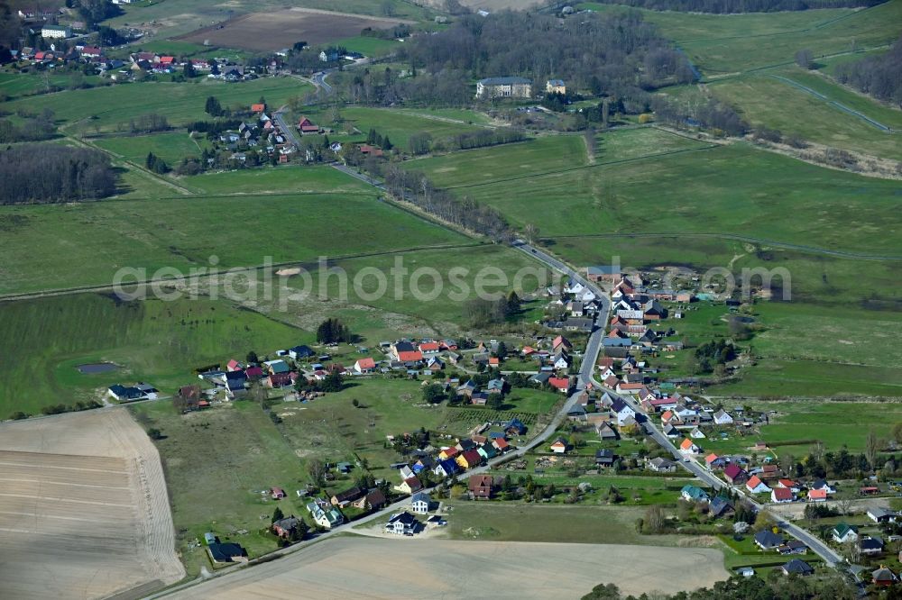 Warsin from above - Agricultural land and field boundaries surround the settlement area of the village in Warsin in the state Mecklenburg - Western Pomerania, Germany