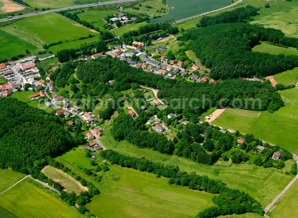 Aerial image Wartenberg-Rohrbach - Agricultural land and field boundaries surround the settlement area of the village in Wartenberg-Rohrbach in the state Rhineland-Palatinate, Germany