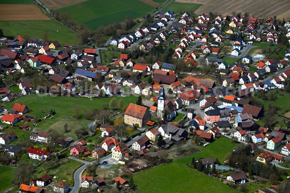 Aerial image Wartenfels - Agricultural land and field boundaries surround the settlement area of the village in Wartenfels in the state Bavaria, Germany