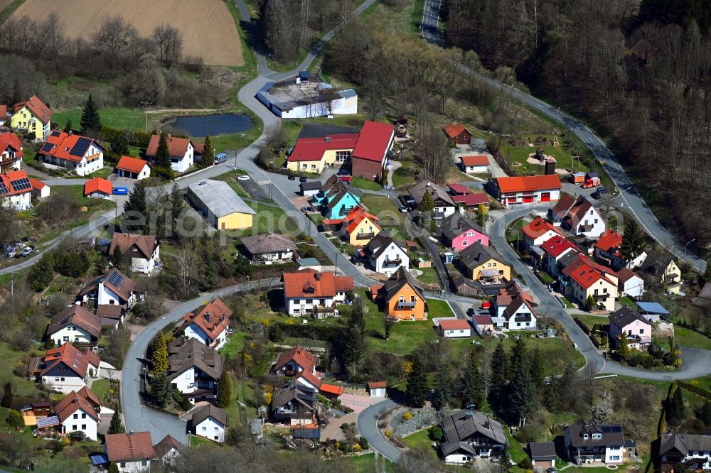 Aerial photograph Wartenfels - Agricultural land and field boundaries surround the settlement area of the village in Wartenfels in the state Bavaria, Germany