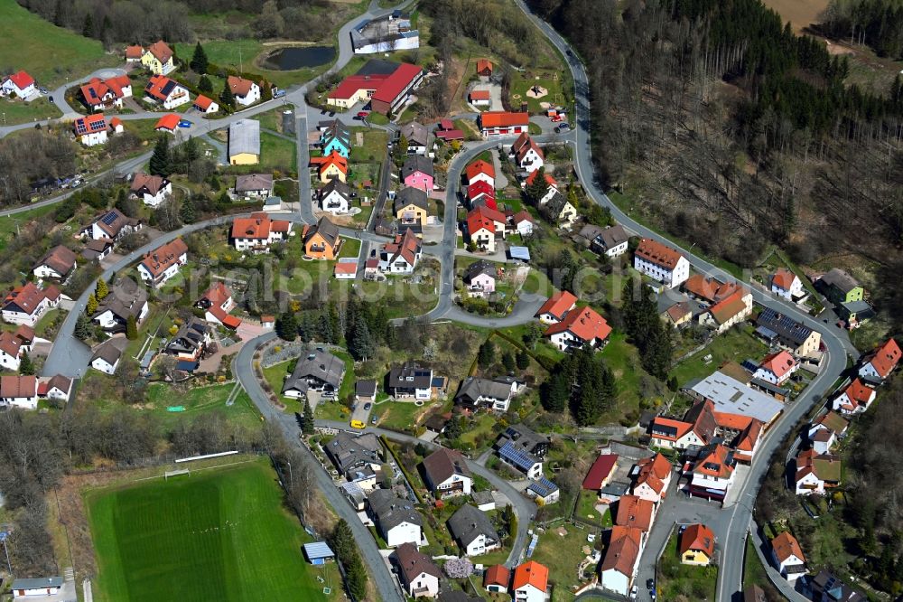 Wartenfels from the bird's eye view: Agricultural land and field boundaries surround the settlement area of the village in Wartenfels in the state Bavaria, Germany