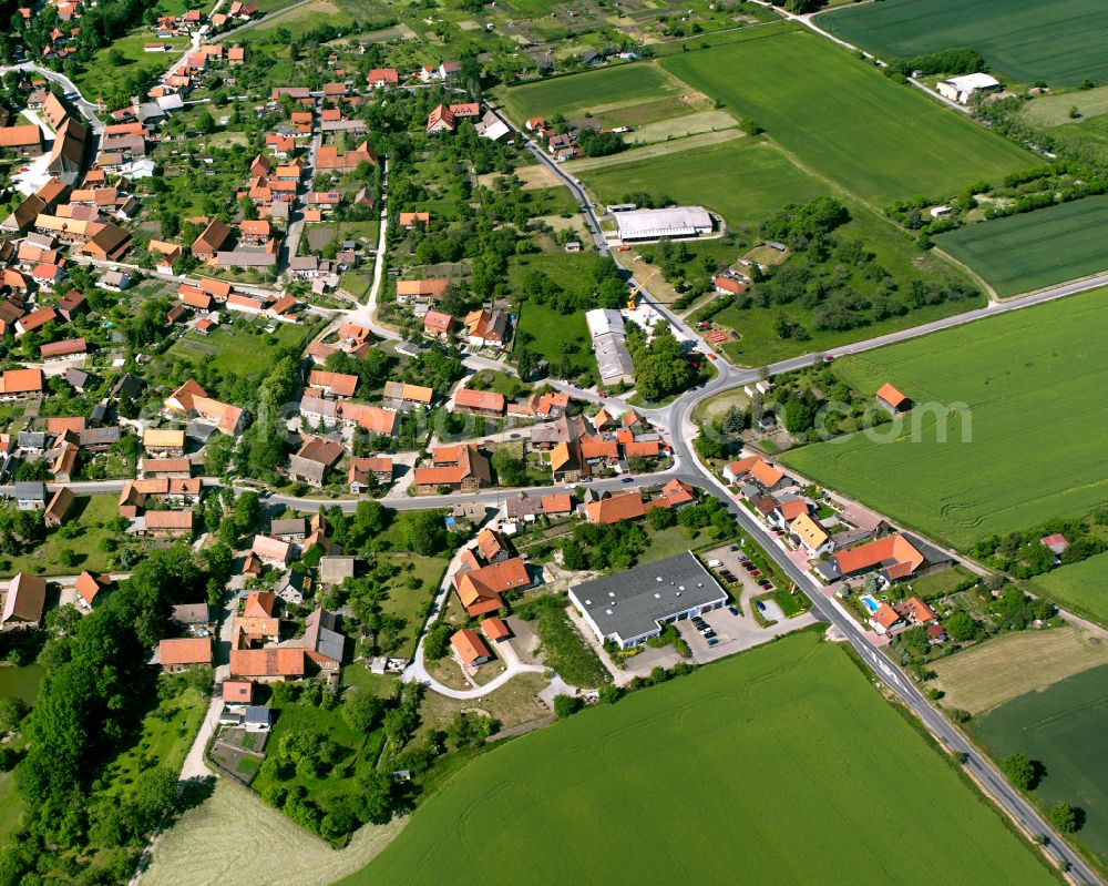 Wasserleben from the bird's eye view: Agricultural land and field boundaries surround the settlement area of the village in Wasserleben in the state Saxony-Anhalt, Germany