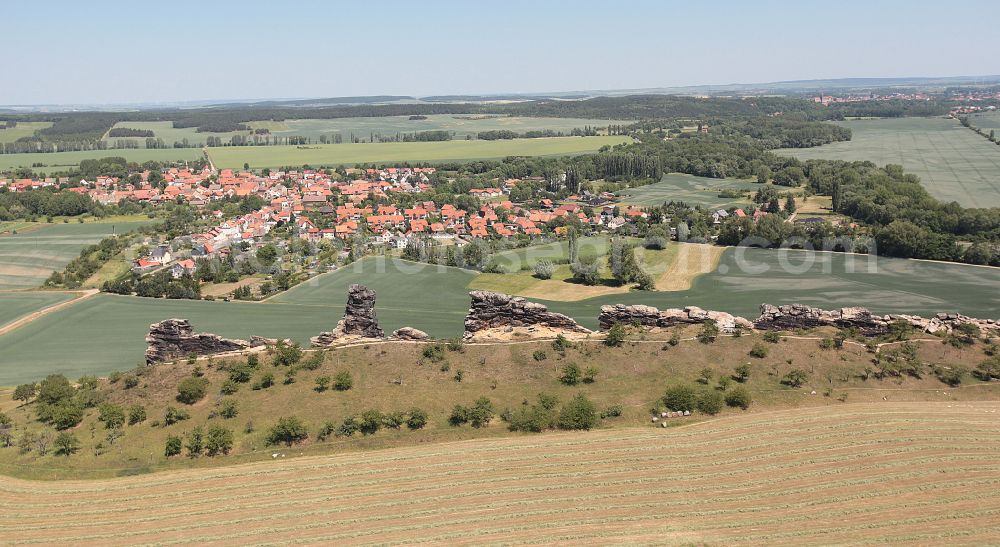 Weddersleben from above - Agricultural land and field boundaries surround the settlement area of the village in Weddersleben in the state Saxony-Anhalt, Germany