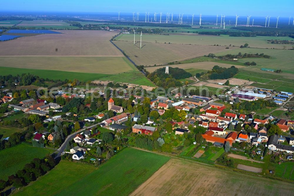 Weesow from above - Agricultural land and field boundaries surround the settlement area of the village in Weesow in the state Brandenburg, Germany