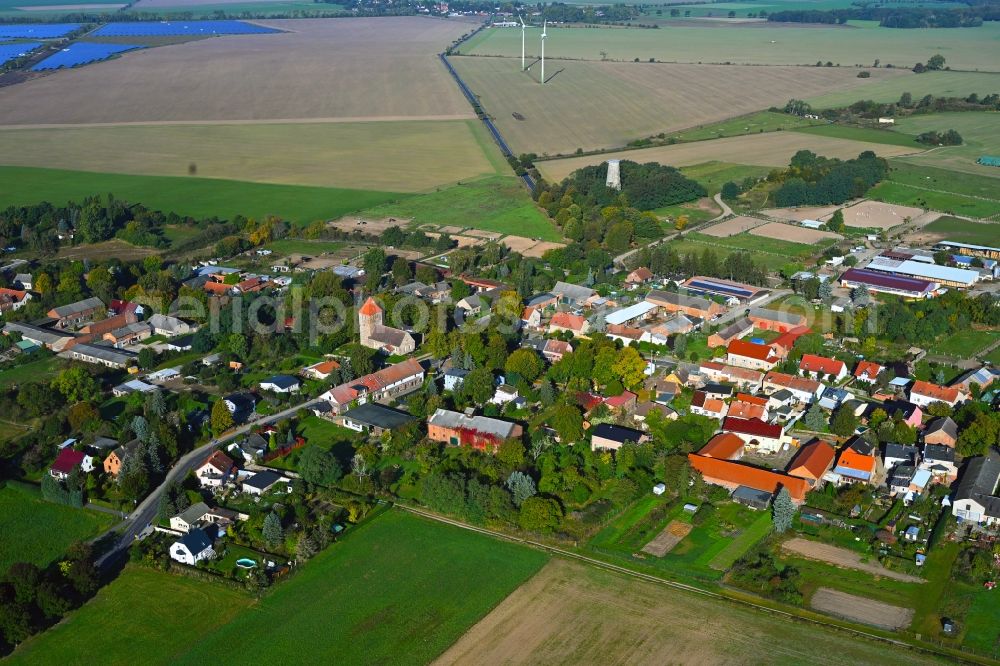 Weesow from the bird's eye view: Agricultural land and field boundaries surround the settlement area of the village in Weesow in the state Brandenburg, Germany