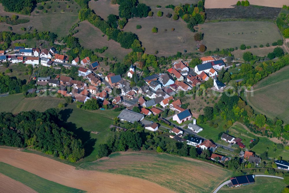 Weickersgrüben from the bird's eye view: Agricultural land and field boundaries surround the settlement area of the village in Weickersgrüben in the state Bavaria, Germany