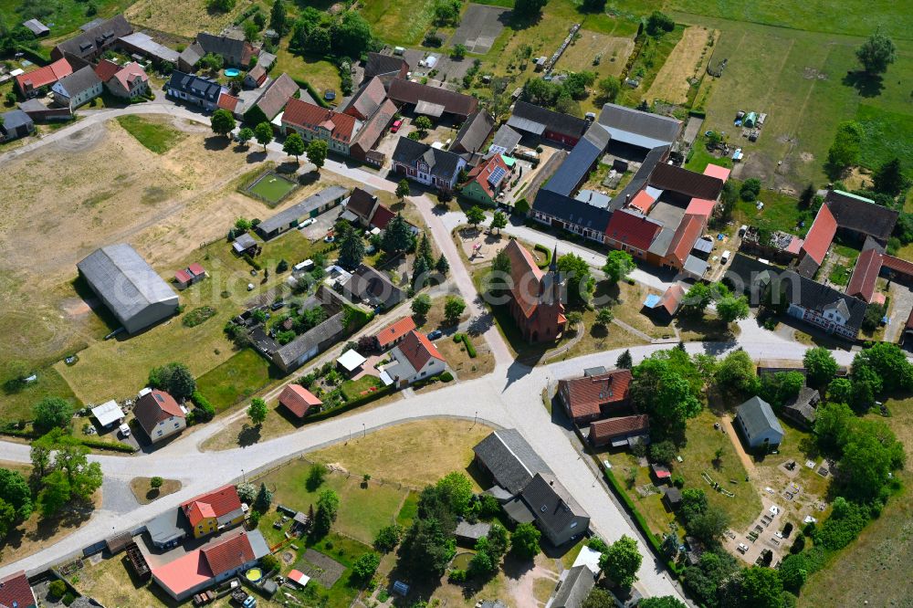 Weiden from above - Agricultural land and field boundaries surround the settlement area of the village in Weiden in the state Saxony-Anhalt, Germany