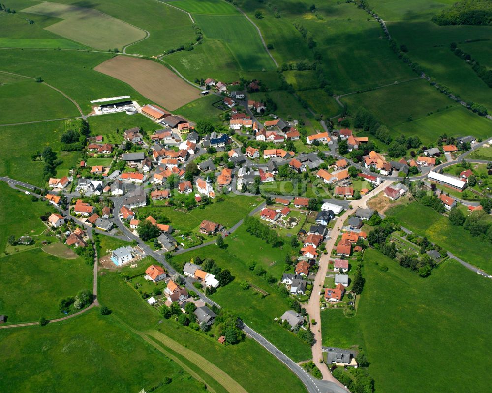 Aerial image Weidenau - Agricultural land and field boundaries surround the settlement area of the village in Weidenau in the state Hesse, Germany