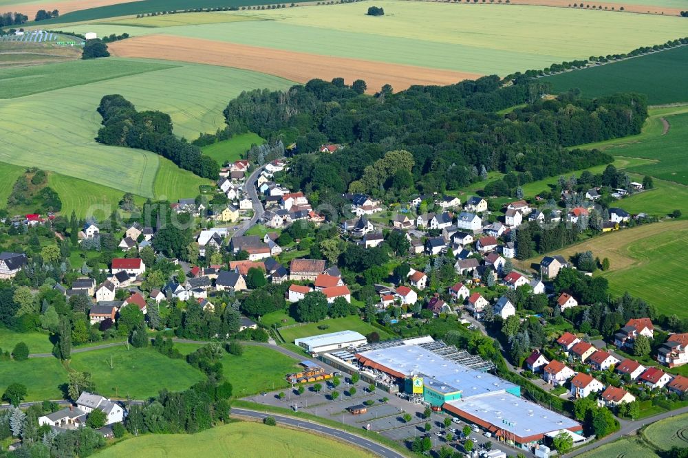 Aerial image Weidensdorf - Agricultural land and field boundaries surround the settlement area of the village in Weidensdorf in the state Saxony, Germany