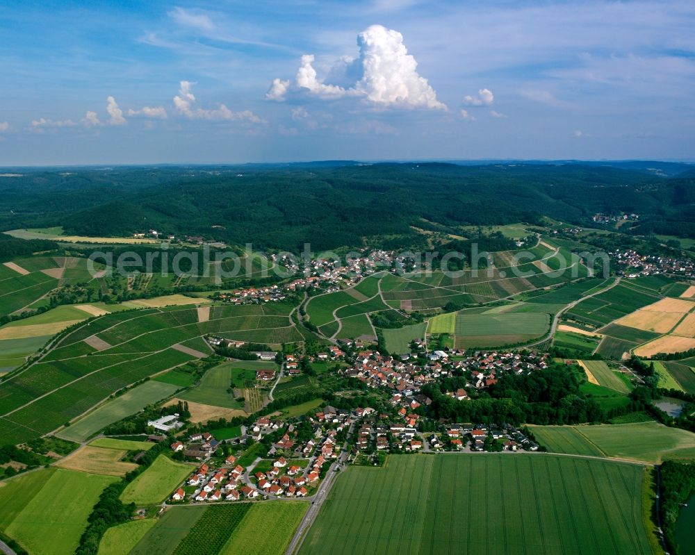 Weiler from above - Agricultural land and field boundaries surround the settlement area of the village in Weiler in the state Baden-Wuerttemberg, Germany