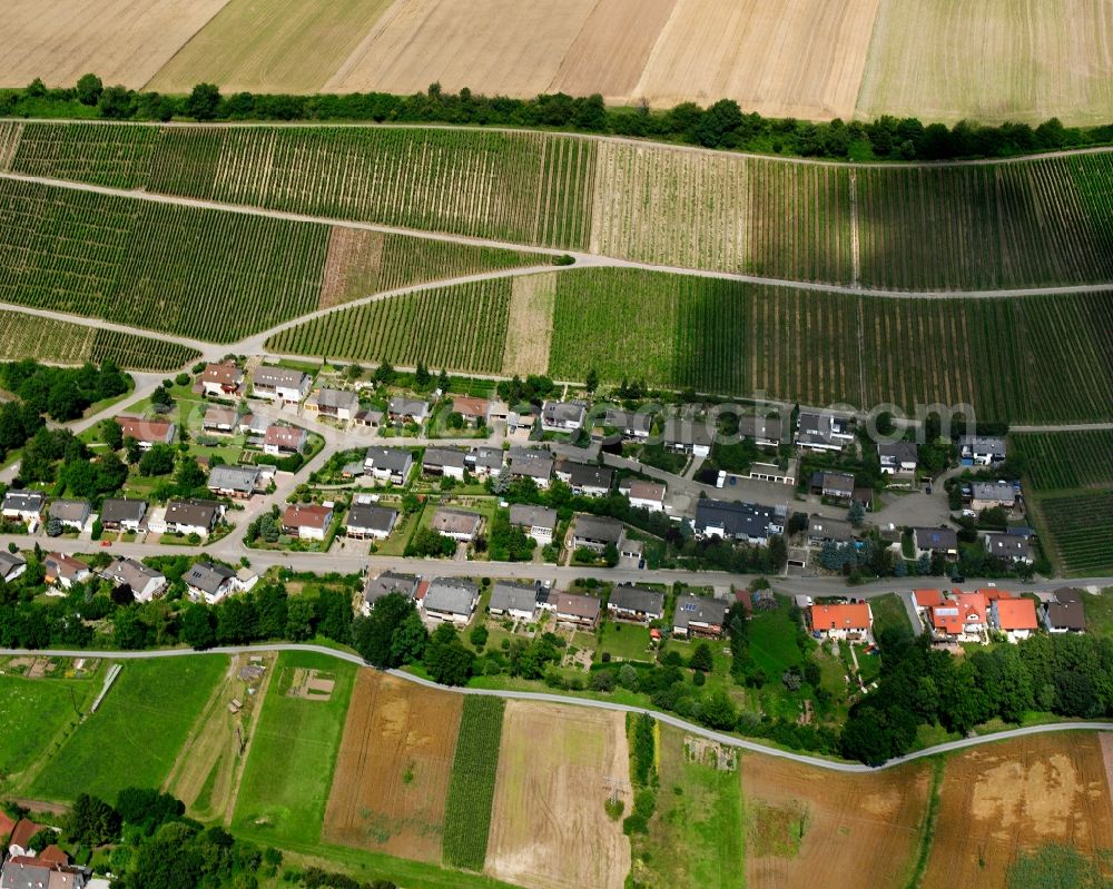 Weiler from the bird's eye view: Agricultural land and field boundaries surround the settlement area of the village in Weiler in the state Baden-Wuerttemberg, Germany