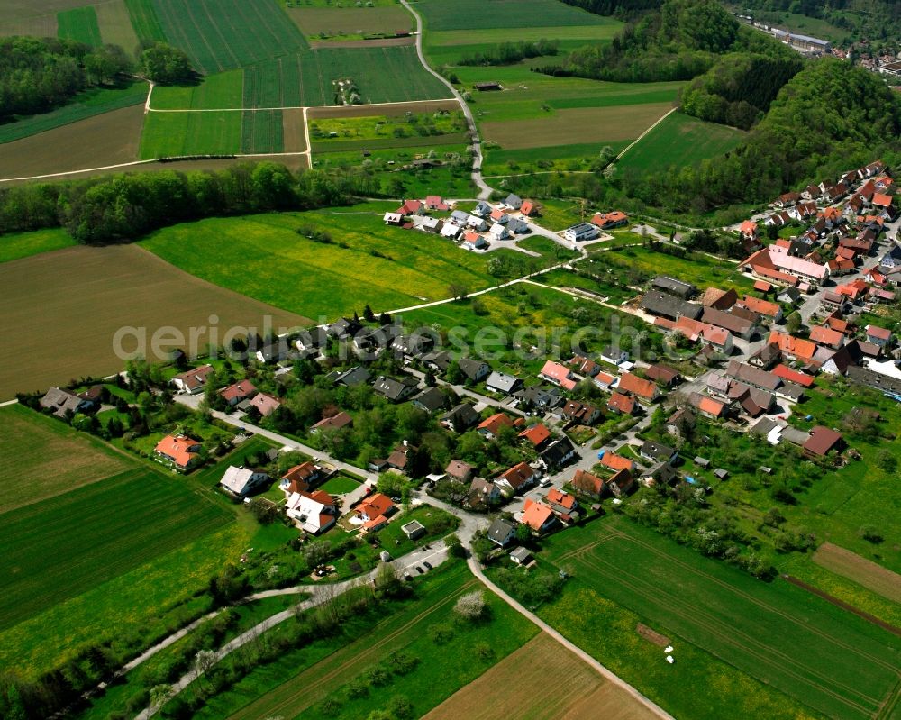 Weiler from the bird's eye view: Agricultural land and field boundaries surround the settlement area of the village in Weiler in the state Baden-Wuerttemberg, Germany