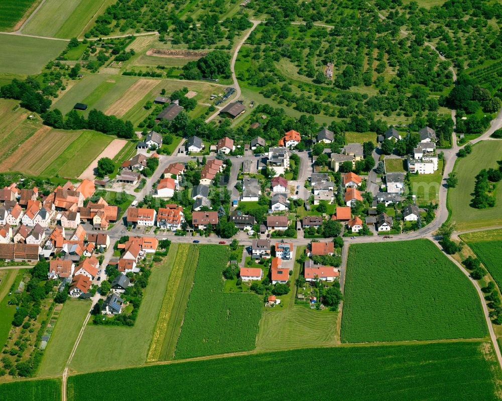 Weilheim from above - Agricultural land and field boundaries surround the settlement area of the village in Weilheim in the state Baden-Wuerttemberg, Germany