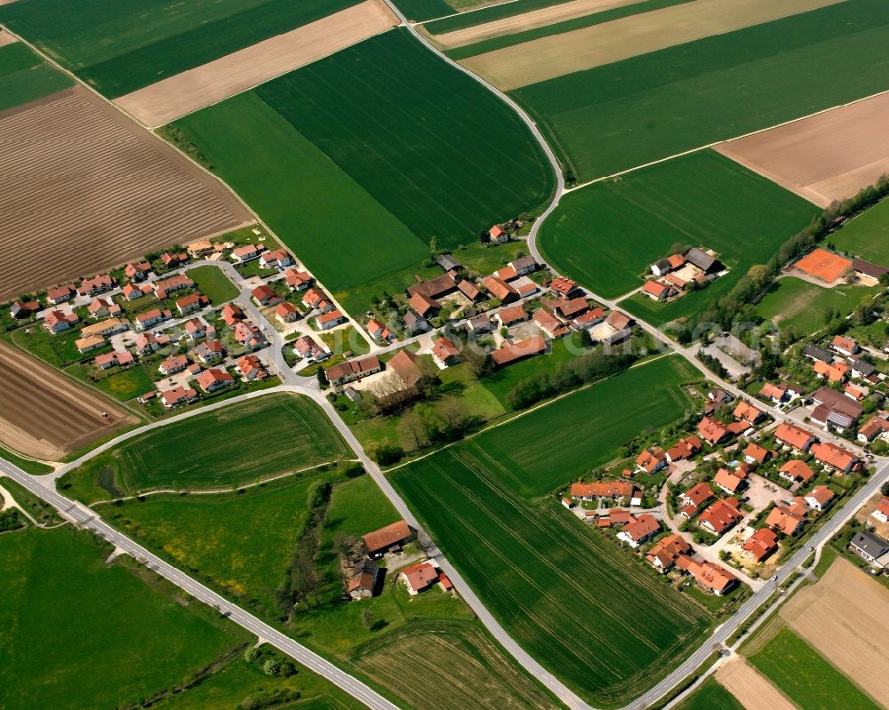 Weiling from above - Agricultural land and field boundaries surround the settlement area of the village in Weiling in the state Bavaria, Germany