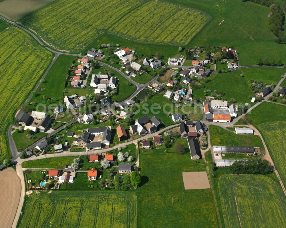 Weinsdorf from the bird's eye view: Agricultural land and field boundaries surround the settlement area of the village in Weinsdorf in the state Saxony, Germany