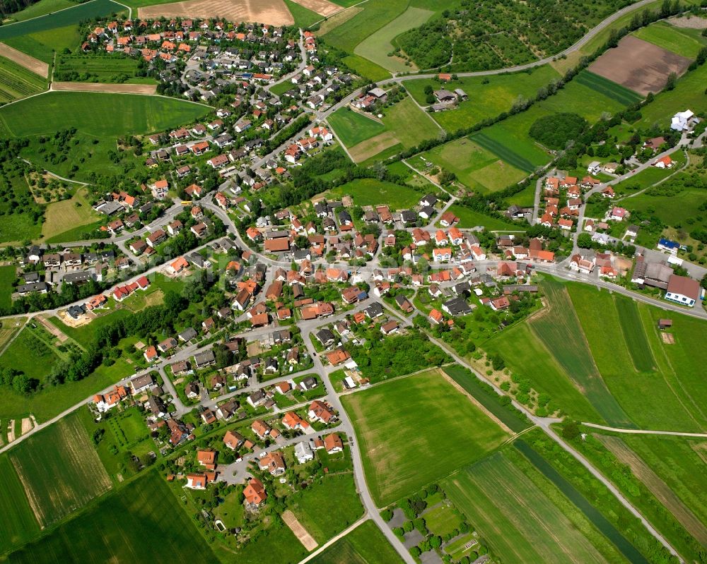 Aerial photograph Weissach im Tal - Agricultural land and field boundaries surround the settlement area of the village in Weissach im Tal in the state Baden-Wuerttemberg, Germany