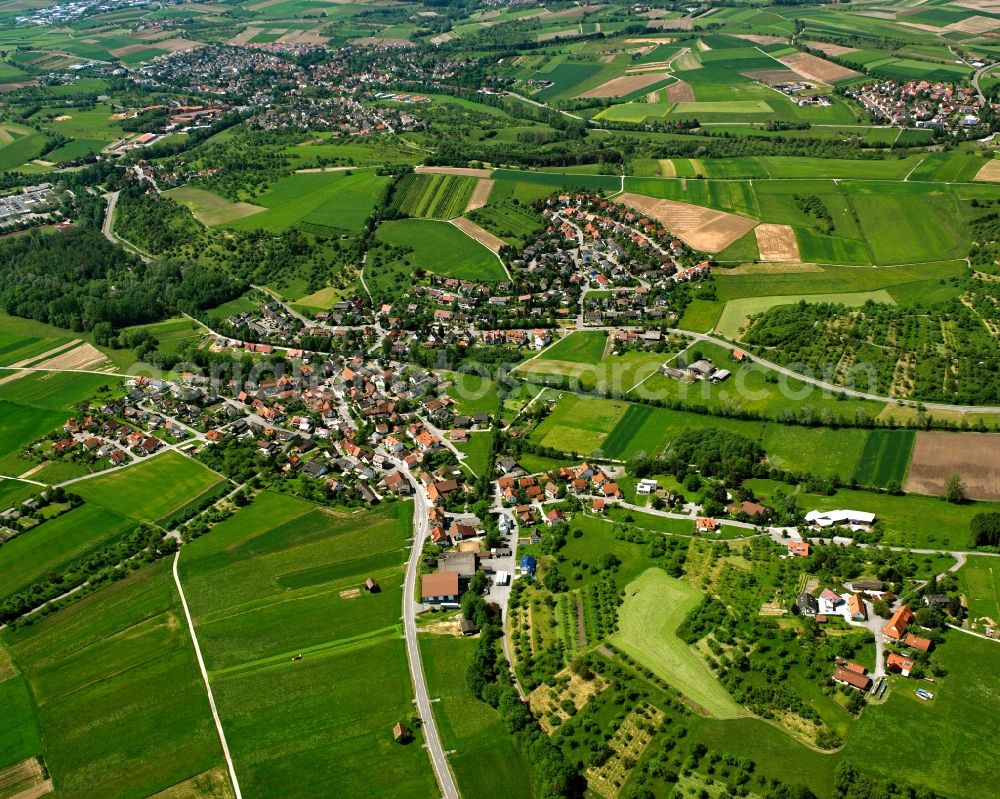 Weissach im Tal from the bird's eye view: Agricultural land and field boundaries surround the settlement area of the village in Weissach im Tal in the state Baden-Wuerttemberg, Germany