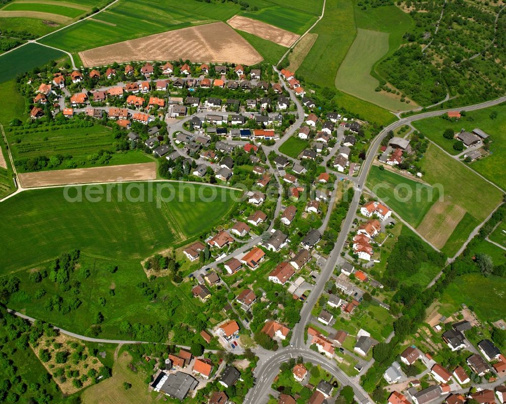 Weissach im Tal from the bird's eye view: Agricultural land and field boundaries surround the settlement area of the village in Weissach im Tal in the state Baden-Wuerttemberg, Germany