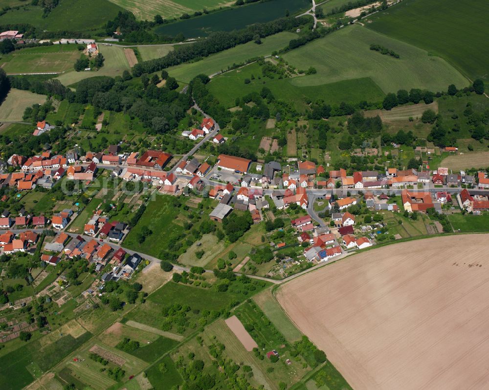 Aerial image Weißenborn-Lüderode - Agricultural land and field boundaries surround the settlement area of the village in Weißenborn-Lüderode in the state Thuringia, Germany