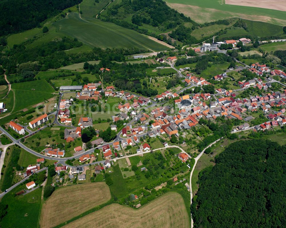 Aerial image Weißenborn-Lüderode - Agricultural land and field boundaries surround the settlement area of the village in Weißenborn-Lüderode in the state Thuringia, Germany