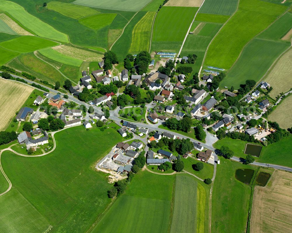 Aerial image Weißlenreuth - Agricultural land and field boundaries surround the settlement area of the village in Weißlenreuth in the state Bavaria, Germany