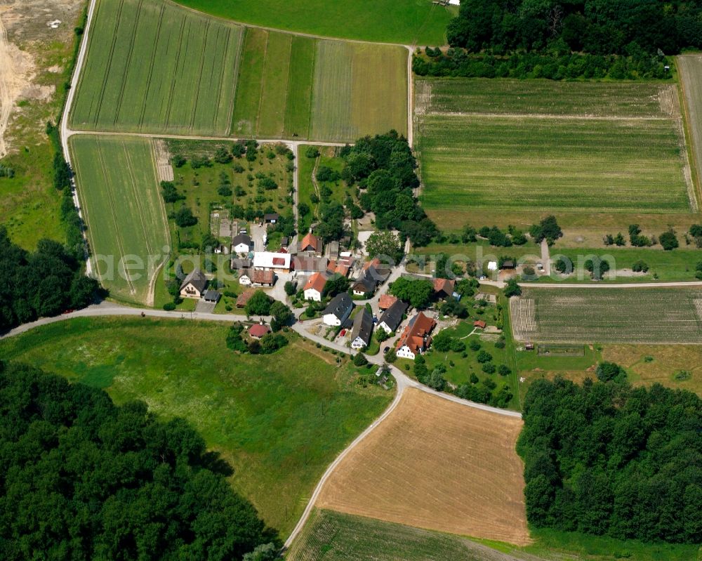 Weitenung from above - Agricultural land and field boundaries surround the settlement area of the village in Weitenung in the state Baden-Wuerttemberg, Germany