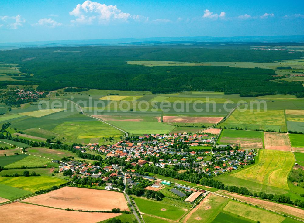 Aerial image Weitersweiler - Agricultural land and field boundaries surround the settlement area of the village in Weitersweiler in the state Rhineland-Palatinate, Germany