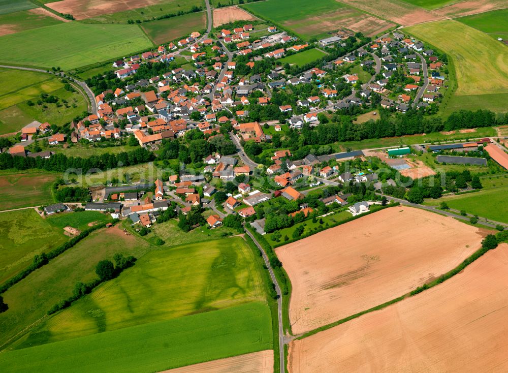 Weitersweiler from the bird's eye view: Agricultural land and field boundaries surround the settlement area of the village in Weitersweiler in the state Rhineland-Palatinate, Germany