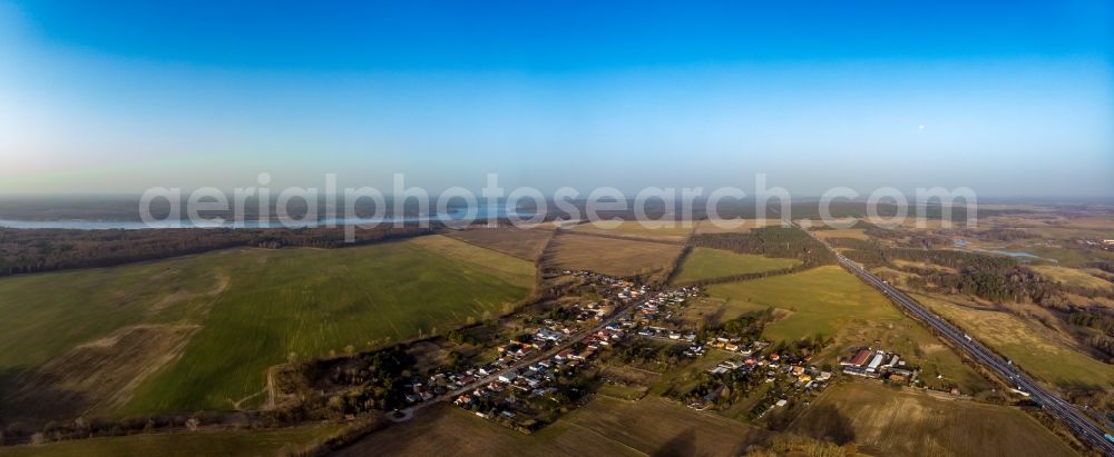 Aerial photograph Werbellin - Agricultural land and field boundaries surround the settlement area of the village in Werbellin at Schorfheide in the state Brandenburg, Germany