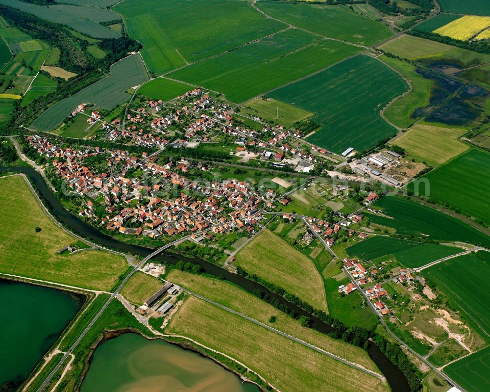 Werra-Suhl-Tal from above - Agricultural land and field boundaries surround the settlement area of the village in Werra-Suhl-Tal in the state Thuringia, Germany