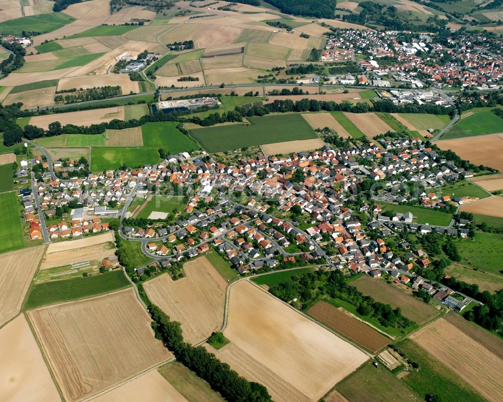 Wersau from the bird's eye view: Agricultural land and field boundaries surround the settlement area of the village in Wersau in the state Hesse, Germany