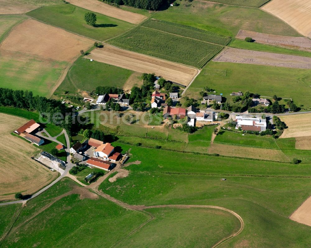 Aerial image Wersau - Agricultural land and field boundaries surround the settlement area of the village in Wersau in the state Hesse, Germany