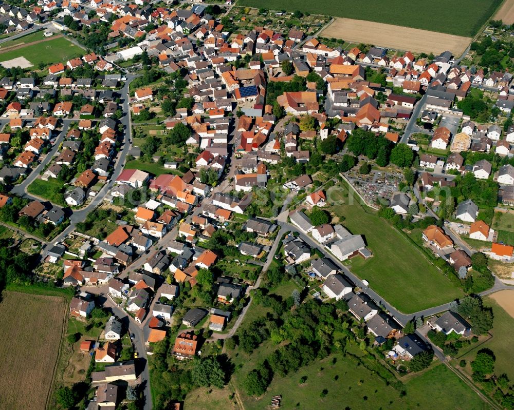 Wersau from above - Agricultural land and field boundaries surround the settlement area of the village in Wersau in the state Hesse, Germany