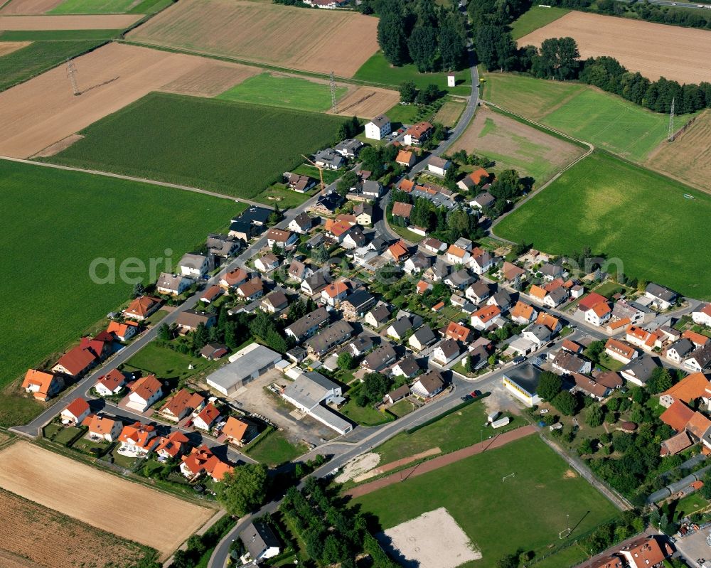 Aerial image Wersau - Agricultural land and field boundaries surround the settlement area of the village in Wersau in the state Hesse, Germany