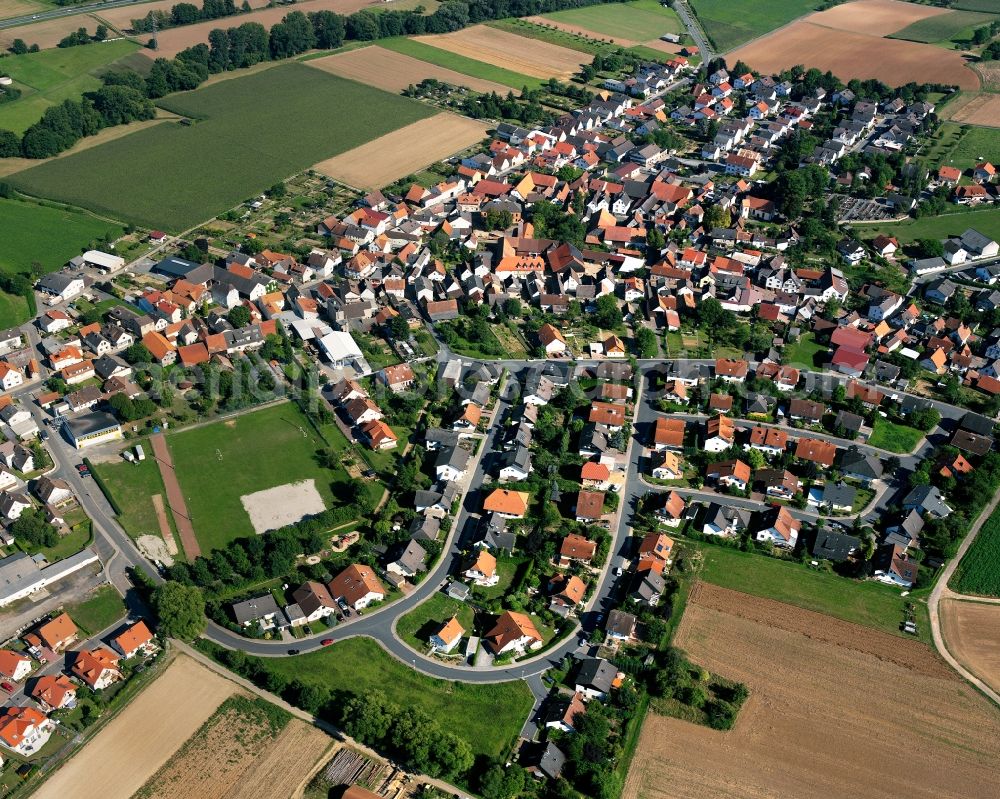 Aerial photograph Wersau - Agricultural land and field boundaries surround the settlement area of the village in Wersau in the state Hesse, Germany