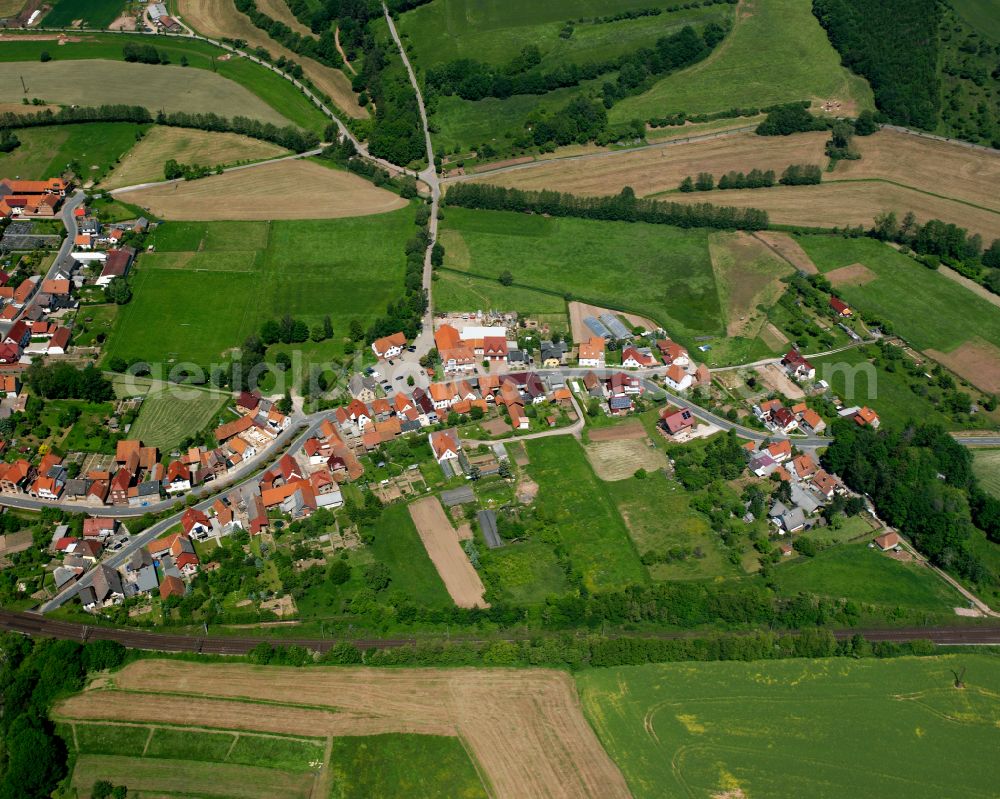 Aerial photograph Westhausen - Agricultural land and field boundaries surround the settlement area of the village in Westhausen in the state Thuringia, Germany